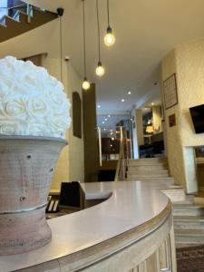 a large white cake sitting on top of a counter at Hôtel Tour Maje in Rodez