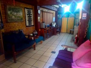 a living room with a couch and a table at Intiaconcagua Habitacion familiar con baño privado in Ciudad Lujan de Cuyo