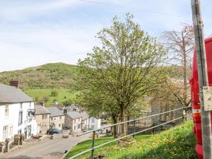 a view of a small village with a red truck at Bank Cottage in Bradwell