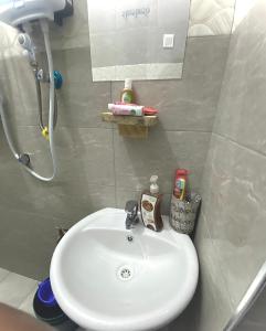 a bathroom with a sink and a shower at Shambani House in Arusha +66 photos