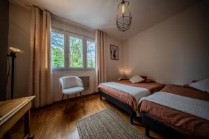 Posteľ alebo postele v izbe v ubytovaní « L’atelier » halte charmante et reposante
