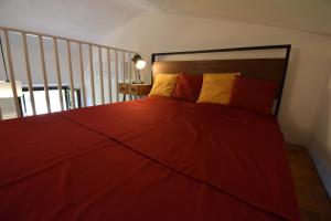 A bed or beds in a room at Duca House