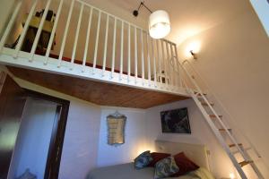 A bed or beds in a room at Duca House