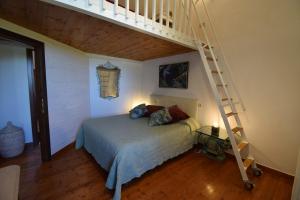 A bed or beds in a room at Duca House