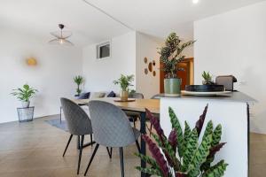 a dining room and living room with potted plants at Casa Vacanze Leon Tremosine in Tremosine Sul Garda
