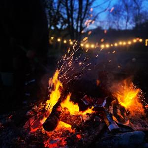 a bonfire with sparks on it at night at Dowr-Gwel Shepherds Hut in Saint Cleer