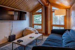 a living room with a couch and a table at Apres Lodge 5 Bedroom in Hailey