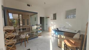 a room with a tub and a sink and a couch at Willa pod Krokodylem in Łeba +28 photos