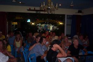 a large group of people sitting in a room at Hostel Stylianos Kissamos in Kissamos