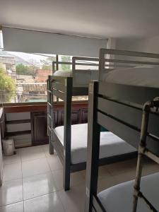 Postel nebo postele na pokoji v ubytování SAN JACINTO HOSTEL