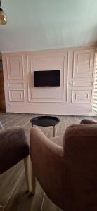 A television and/or entertainment centre at Apartments Stari Jasen Uvac