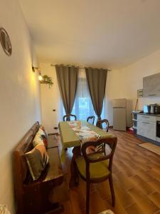 a living room with a table and a couch at Casita in Radda in Chianti