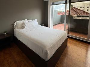 Postel nebo postele na pokoji v ubytování Gaviota Apartments & Suites