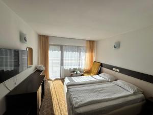 Un pat sau paturi într-o cameră la Chalet Minut