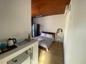 Ένα ή περισσότερα κρεβάτια σε δωμάτιο στο Rooms of Nectar