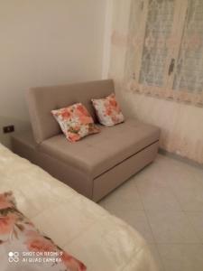 a couch in a room with two pillows on it at Belvedere di Caiazzo in Caiazzo +14 photos