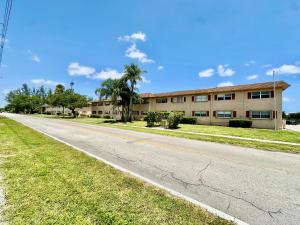 an empty road in front of a building at Downtown Boca Apt in Boca Raton