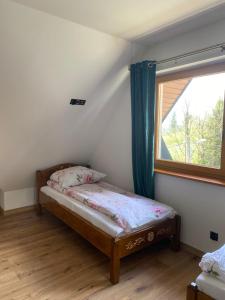 Postel nebo postele na pokoji v ubytování Mały Gazda