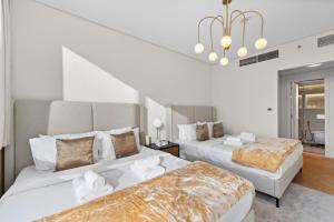 Luxury Apt DIFC, XL Layout, Pool, Gym, Skyline Viewにあるベッド