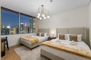 Luxury Apt DIFC, XL Layout, Pool, Gym, Skyline Viewにあるベッド