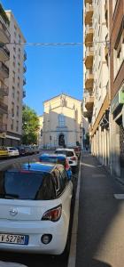 a row of parked cars parked on a city street at Roiano Cinque in Trieste