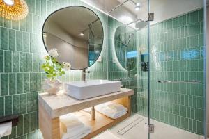 a bathroom with a sink and a mirror at Davinia Hua Hin Resort in Hua Hin +66 photos