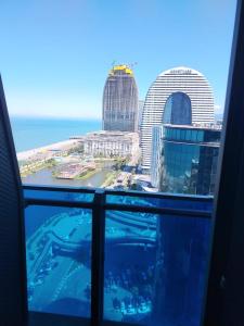 a view of a city from the window of a building at Orbi city bloke A in Angisa