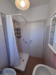 a bathroom with a shower and a toilet and a sink at Voce del Casentino in Castel San Niccolò +23 photos