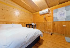 Postel nebo postele na pokoji v ubytování Shanding Shang Homestay