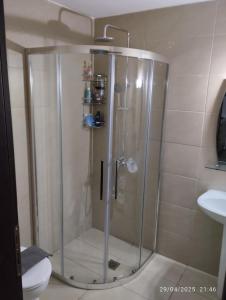 a shower with a glass door in a bathroom at Rosemary Apartment in Exopoli, Georgioupolis in Exopoli