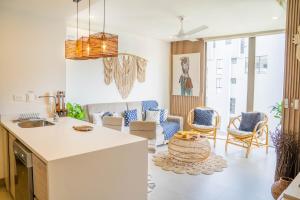 a kitchen and living room with a table and chairs at Fantastic Apartment/Beach Front Luxury in Cartagena de Indias