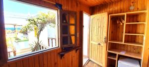 a room with an open door and a window at Neptune Hotel in Dahab