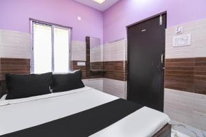 Postel nebo postele na pokoji v ubytování Hotel O PPS NEST Guest House