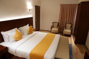 Postel nebo postele na pokoji v ubytování The Orange Hotel - Narsingi, Hyderabad
