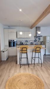 Kuchyň nebo kuchyňský kout v ubytování L'atelier - logement neuf sur la route des vins d'Alsace