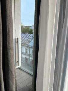 an open window with a view of a building at Rajska 3 in Kraków