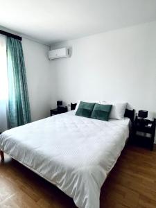 Postel nebo postele na pokoji v ubytování Vila Macris