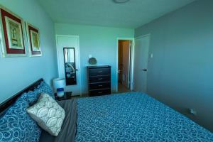 Postelja oz. postelje v sobi nastanitve Lovely 2-2 Condo with the best view of Puerto Rico