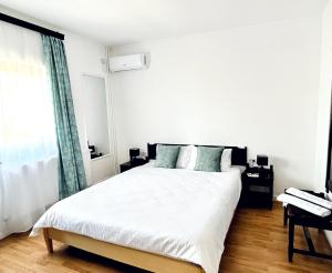 Postel nebo postele na pokoji v ubytování Vila Macris
