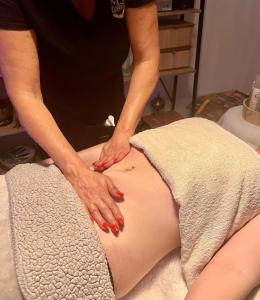 a woman with red nail polish on the belly of a pregnant woman at Suite parentale dans belle villa de plein pied in Gaillac