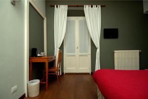 TV a/nebo společenská místnost v ubytování B&B Residenza Cavour