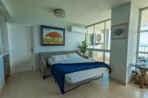 Postelja oz. postelje v sobi nastanitve Lovely 2-2 Condo with the best view of Puerto Rico