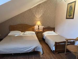 Ένα ή περισσότερα κρεβάτια σε δωμάτιο στο Hotel Brigitte