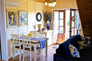 a dining room with a table and chairs in a room at ONX WINES - Briarwood Apartment in Templeton +5 photos