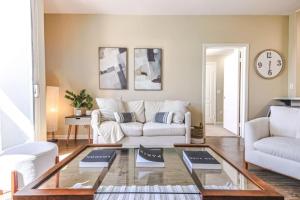 a living room with a couch and a table at Spacious 2BDR Condo near Venice Beach in Los Angeles