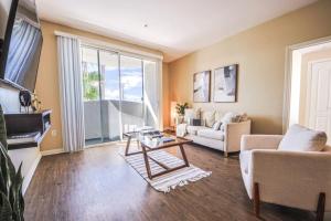 a living room with a couch and a table at Spacious 2BDR Condo near Venice Beach in Los Angeles