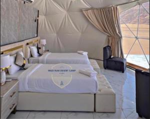 Postel nebo postele na pokoji v ubytování WADl RUM DESERT CAMP