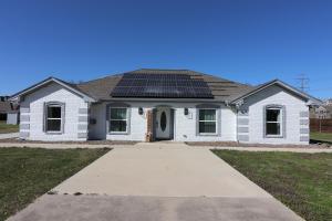 a house with solar panels on the roof at 4bed, 2bath cozy-luxury-modern house in Grand Prairie