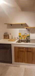 a kitchen with a sink and a counter top at Divina House 2BR 2BA beach access in Broce