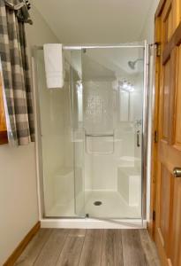 a shower in a bathroom with a glass door at Aspen - by The Chalets in Logan +22 photos